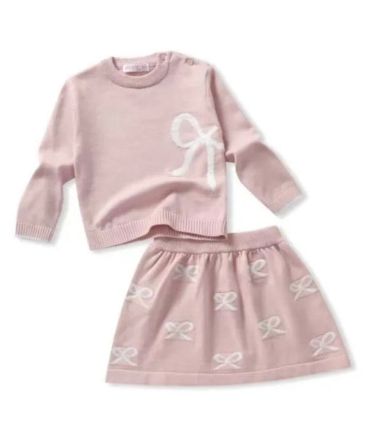 Roze setje trui en rok met strikken