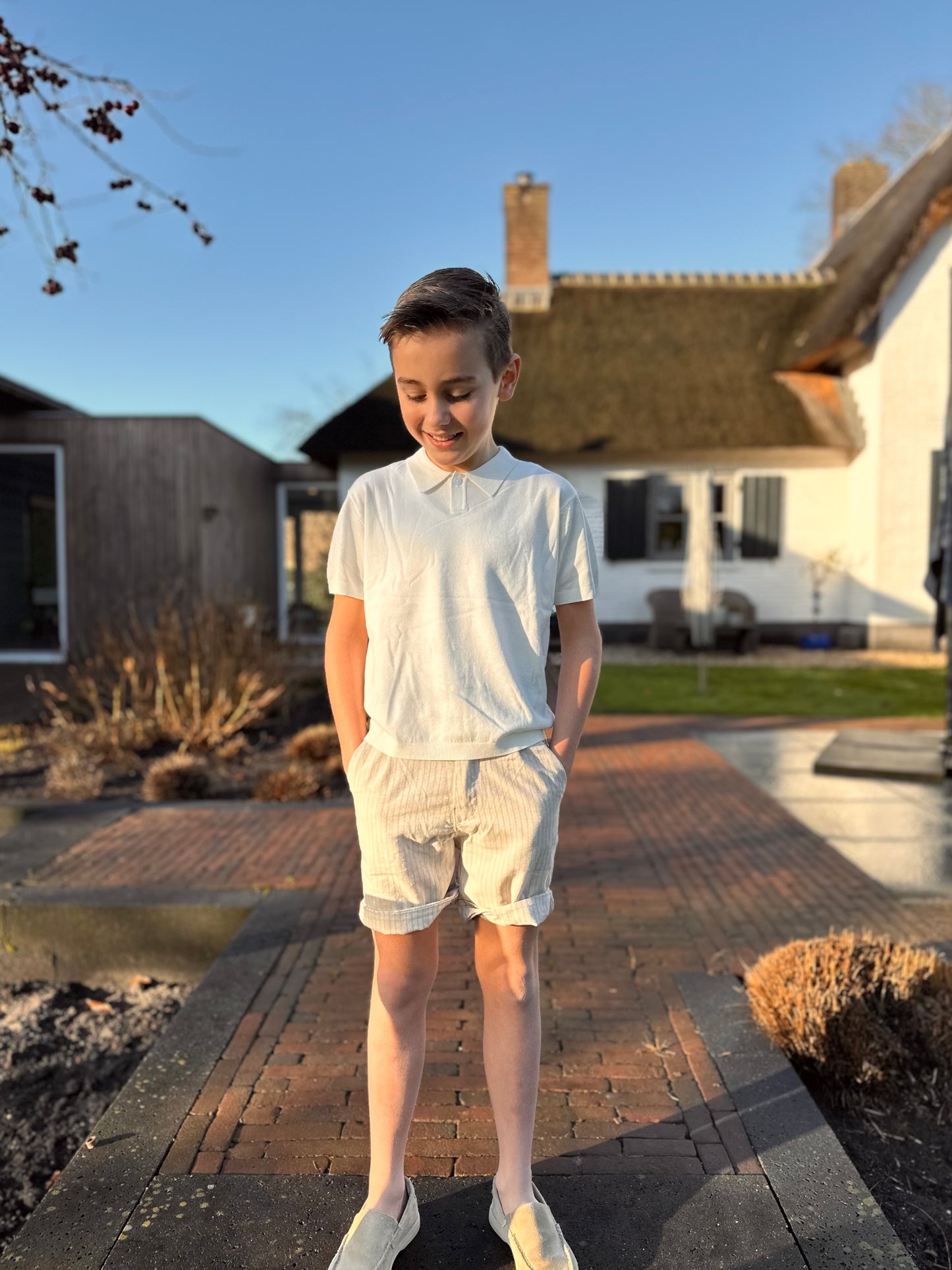 Set gebreide polo en gestreepte broek